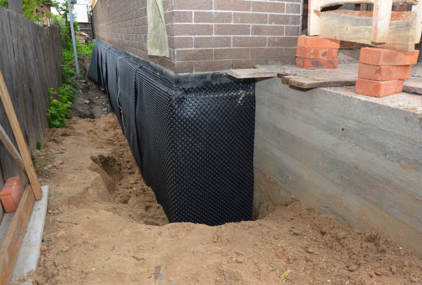 Happy homeowners after waterproofing job in Mishawaka